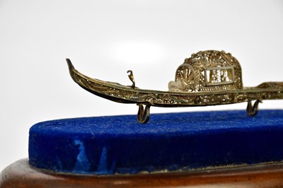 Lot 2179 - A white metal miniature model of a gondola, on...