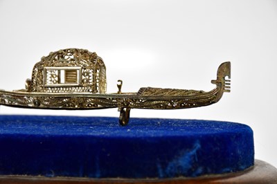 Lot 2179 - A white metal miniature model of a gondola, on...