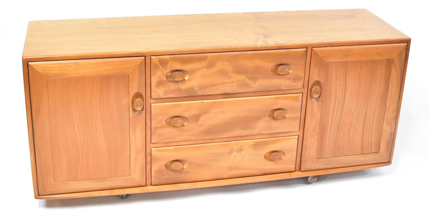 Lot 2 - ERCOL; a light elm Windsor sideboard, with...
