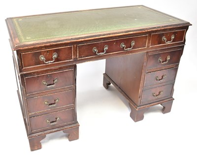 Lot 31 - A Georgian-style mahogany twin-pedestal desk,...
