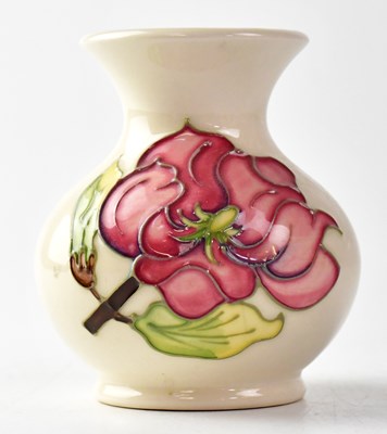 Lot 298 - MOORCROFT; a 'Magnolia' pattern squat vase...