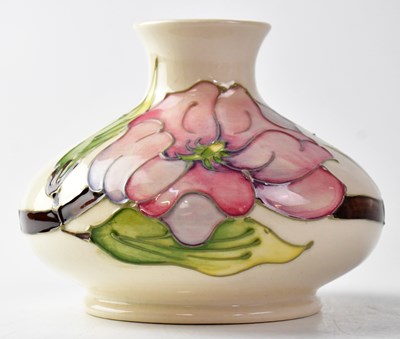 Lot 302 - MOORCROFT; a 'Magnolia' pattern squat vase,...