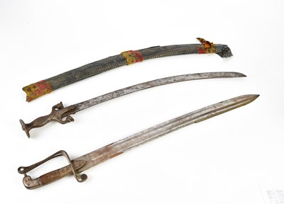 Lot 2561 - An Indian talwar with cast metal handle,...