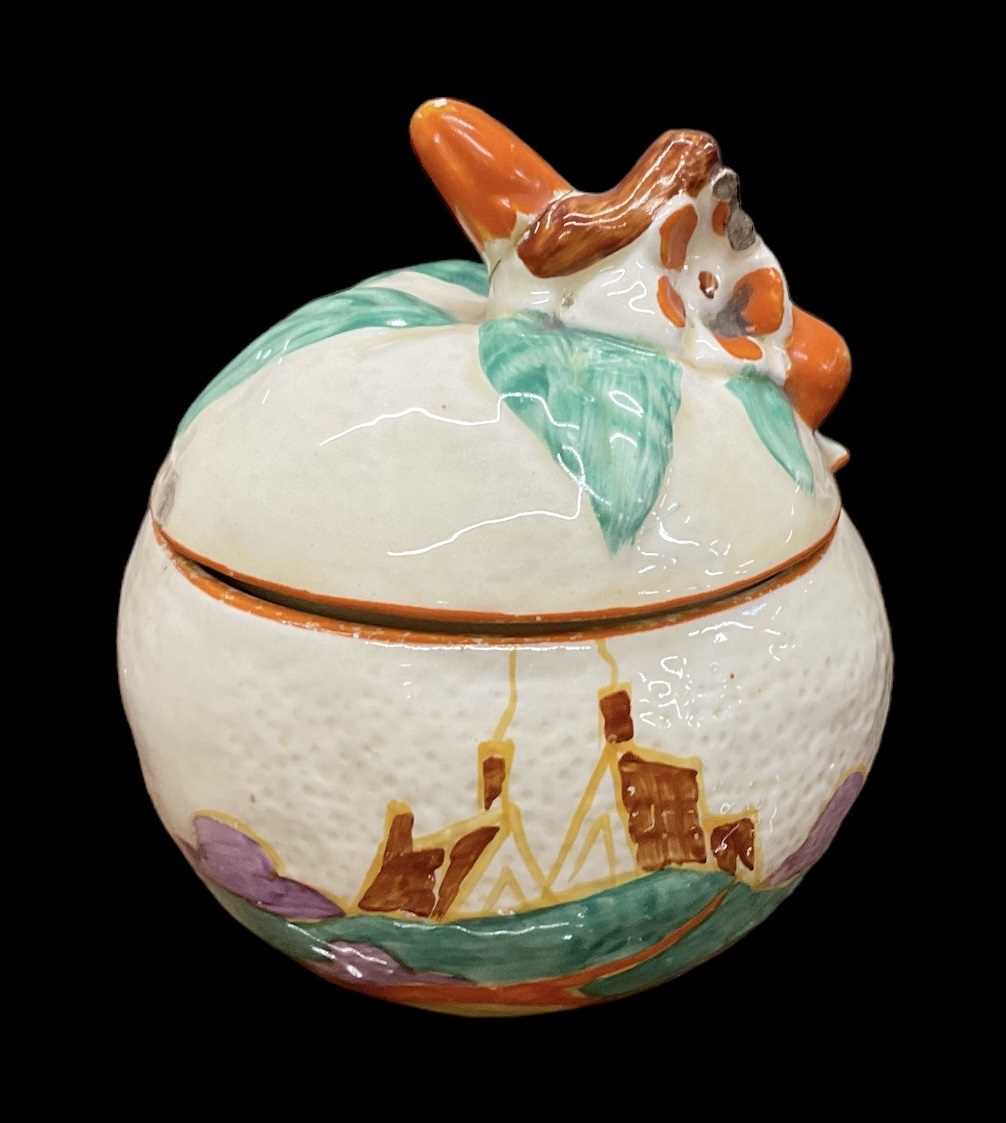 Lot 542 - CLARICE CLIFF; a 'Bizarre' preserve jar and...