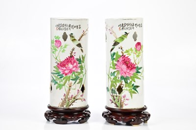 Lot 1192 - A pair of Chinese Famille Rose sleeve vases...