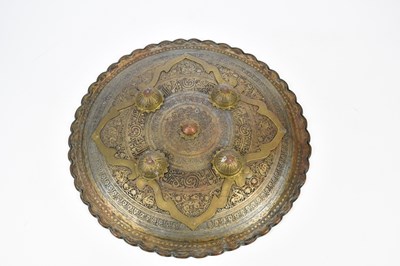 Lot 2573 - An Eastern dahl type shield with cast and...