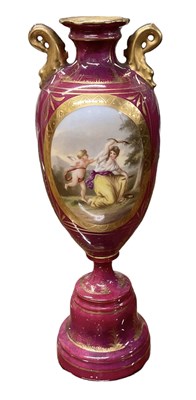 Lot 601 - A Vienna porcelain red ground hand painted urn...