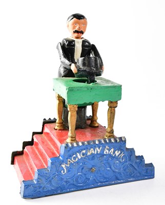 Lot 262 - A novelty money bank modelled as a magician...