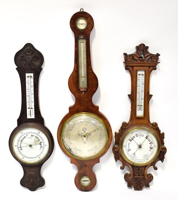 Lot 147 - Two carved Victorian barometer/thermometers...