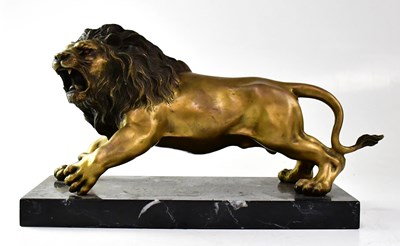 Lot 182 - A gilded bronzed figure of a lion, raised on a...