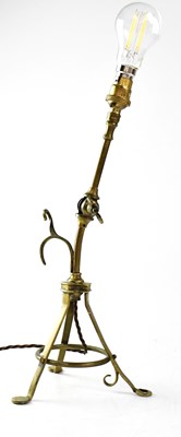 Lot 124 - An unusual brass articulated reading lamp with...