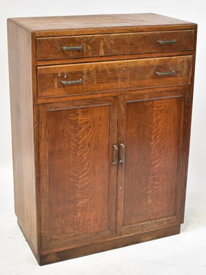 Lot 45 - A 1940s oak side cabinet with two drawers...