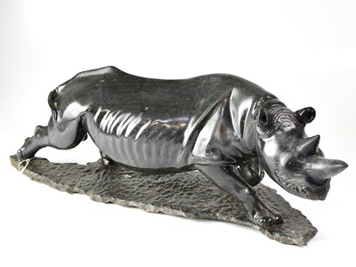 Lot 187 - An unusual carved hardstone figure of a rhino...