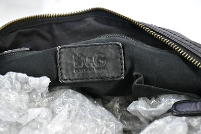 Lot 775 - DOLCE & GABBANA; a black leather man's holdall...