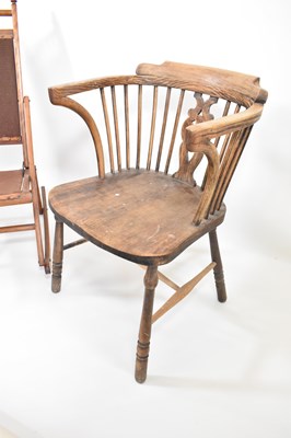 Lot 69 - A 19th century elm Windsor chair with stick...