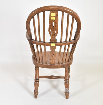 Lot 90 - A children's oak stick back Windsor chair,...