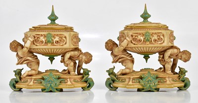 Lot 1340 - ROYAL WORCESTER; a pair of unusual lidded urn...