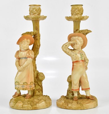 Lot 1546 - ROYAL WORCESTER; a pair of blush ivory figural...