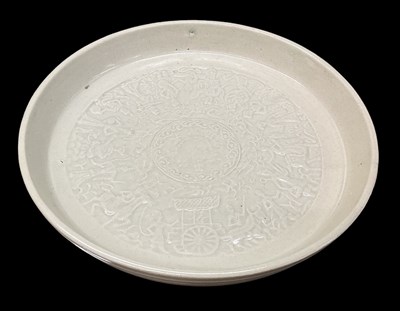 Lot 1025 - A Chinese celadon glazed dish, the interior...