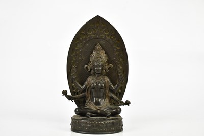 Lot 1172 - A Chinese bronze figure of a female deity with...