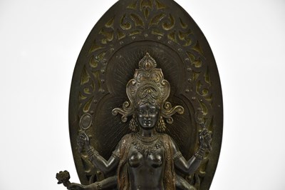 Lot 1172 - A Chinese bronze figure of a female deity with...