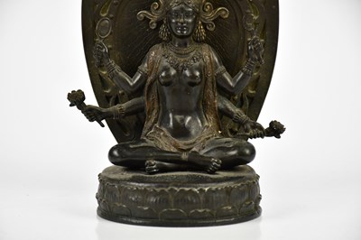 Lot 1172 - A Chinese bronze figure of a female deity with...