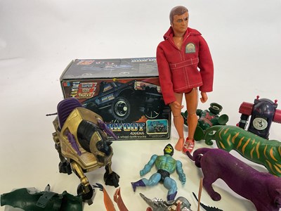 Lot 324 - A box of action figure toys, to include He-Man,...