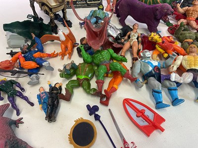 Lot 324 - A box of action figure toys, to include He-Man,...