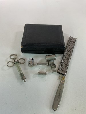 Lot 94 - A small group of medical items, including a...