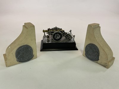 Lot 144 - A pair of book ends with impressed metal...