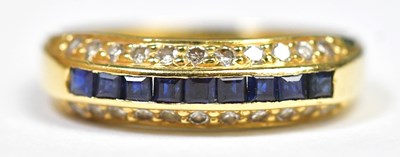 Lot 711 - An 18ct gold diamond and sapphire ring, the...