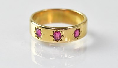 Lot 715 - An 18ct gold wide band ring, star set with...