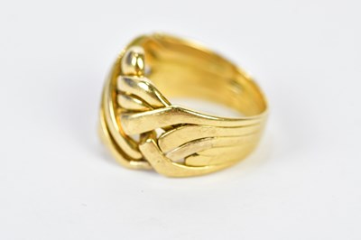 Lot 86 - An 18ct yellow gold puzzle ring, size O,...