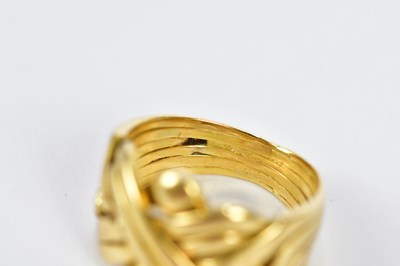 Lot 86 - An 18ct yellow gold puzzle ring, size O,...