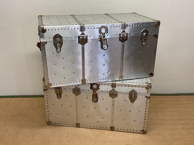 Lot 620 - Two aluminium travelling trunks with rivet...