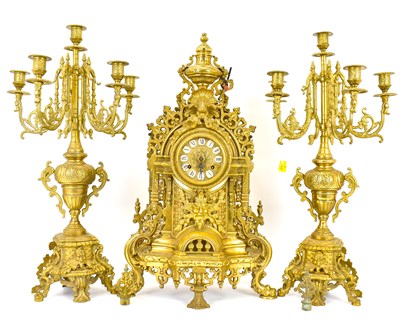 Lot 136 - A German brass three-piece clock garniture of...