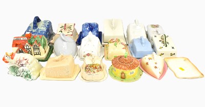 Lot 338 - Thirteen ceramic cheese domes and trays to...