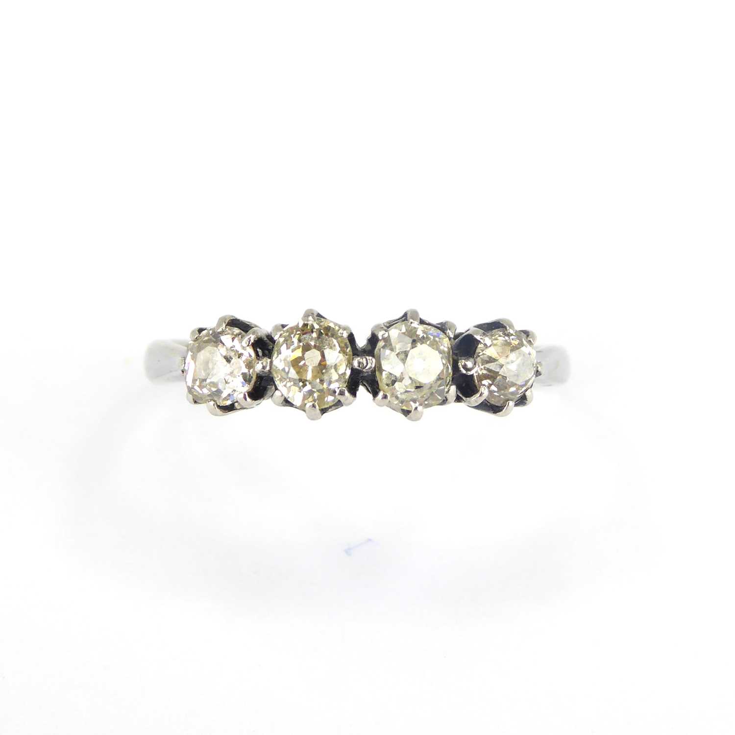 Lot 696 - An 18ct white gold four-stone diamond ring,...