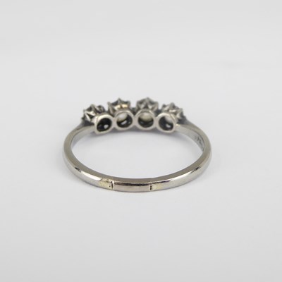 Lot 696 - An 18ct white gold four-stone diamond ring,...