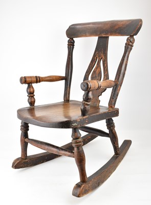 Lot 92 - A children's small Windsor rocking chair.