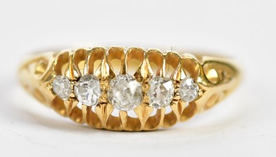 Lot 101 - An 18ct yellow gold five stone graduated...