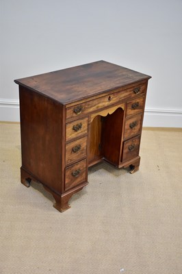 Lot 60 - A George III mahogany kneehole desk with an...