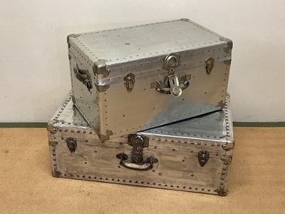 Lot 627 - Two aluminium travelling trunks with rivet...