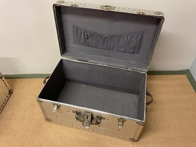 Lot 627 - Two aluminium travelling trunks with rivet...