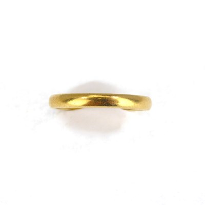 Lot 684 - A 22ct gold thin wedding band, size L, approx....