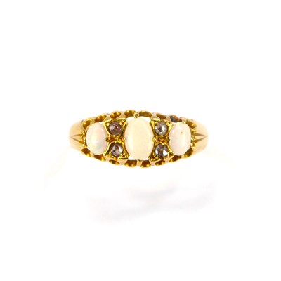 Lot 709 - An 18ct gold ring set with three oval white...