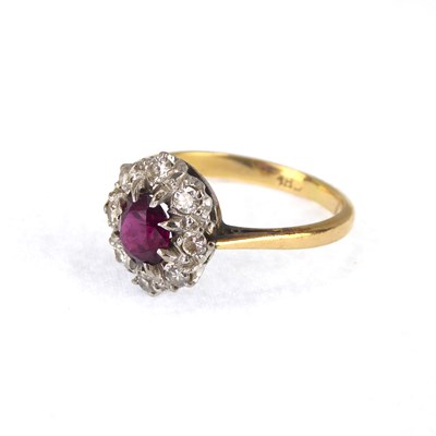 Lot 701 - An 18ct gold ring set with central claw set...