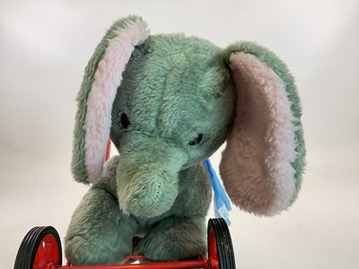 Lot 374 - DEANS; a vintage push along plush elephant,...