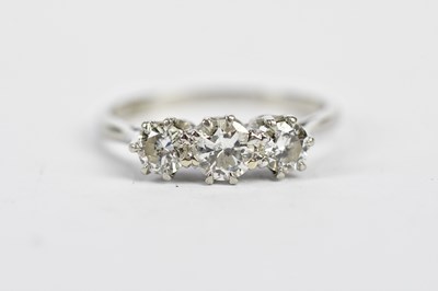 Lot 99 - A platinum and diamond three stone graduated...