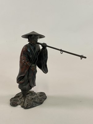 Lot 113 - A bronzed metal figure of a Japanese farmer,...